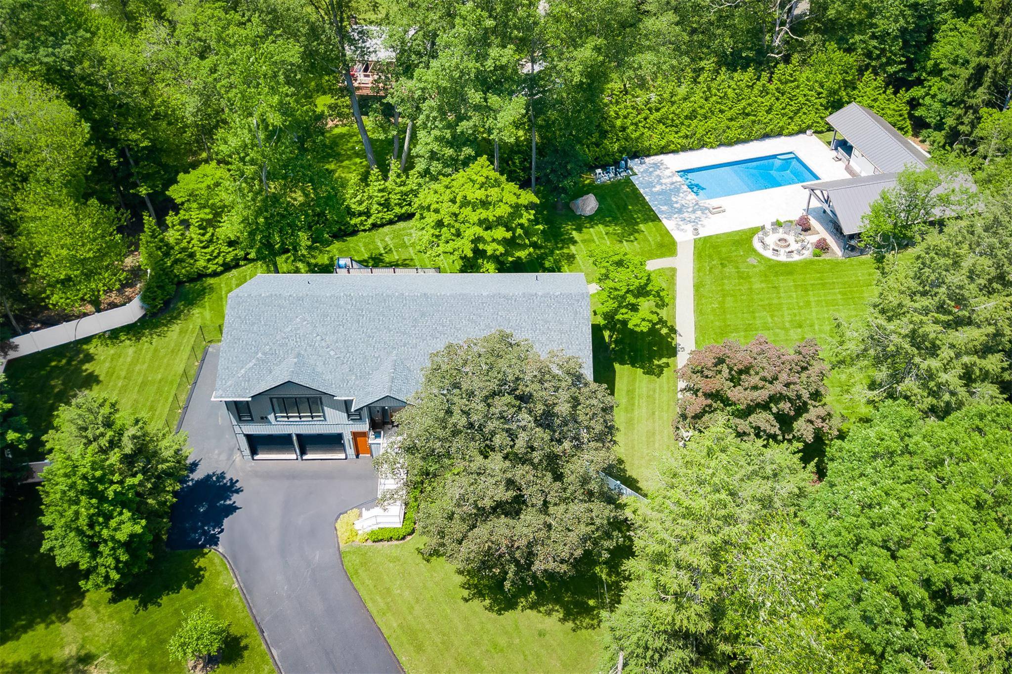 Magnificent newly built contemporary home sits on nearly an acre of perfectly manicured land, bordered by mature trees and a fully fenced property line offers the ultimate privacy.