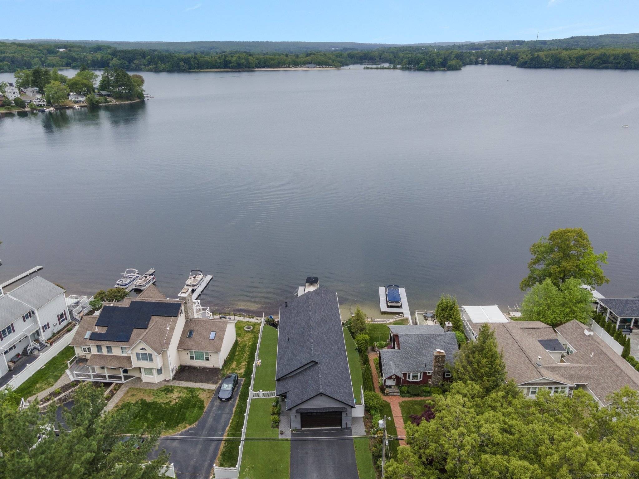 Beautiful morning Views, breathtaking evening sunsets, and all day gorgeous scenery is what you will experience as you look out at Webster lake from this amazing 5 year young ranch ...