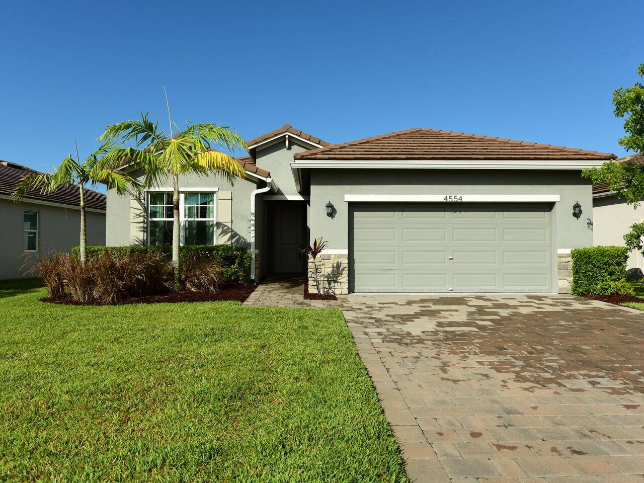 This like new 3 2 2 home in Jensen Beach offers a perfect blend of modern living prime location, just minutes from the beach.