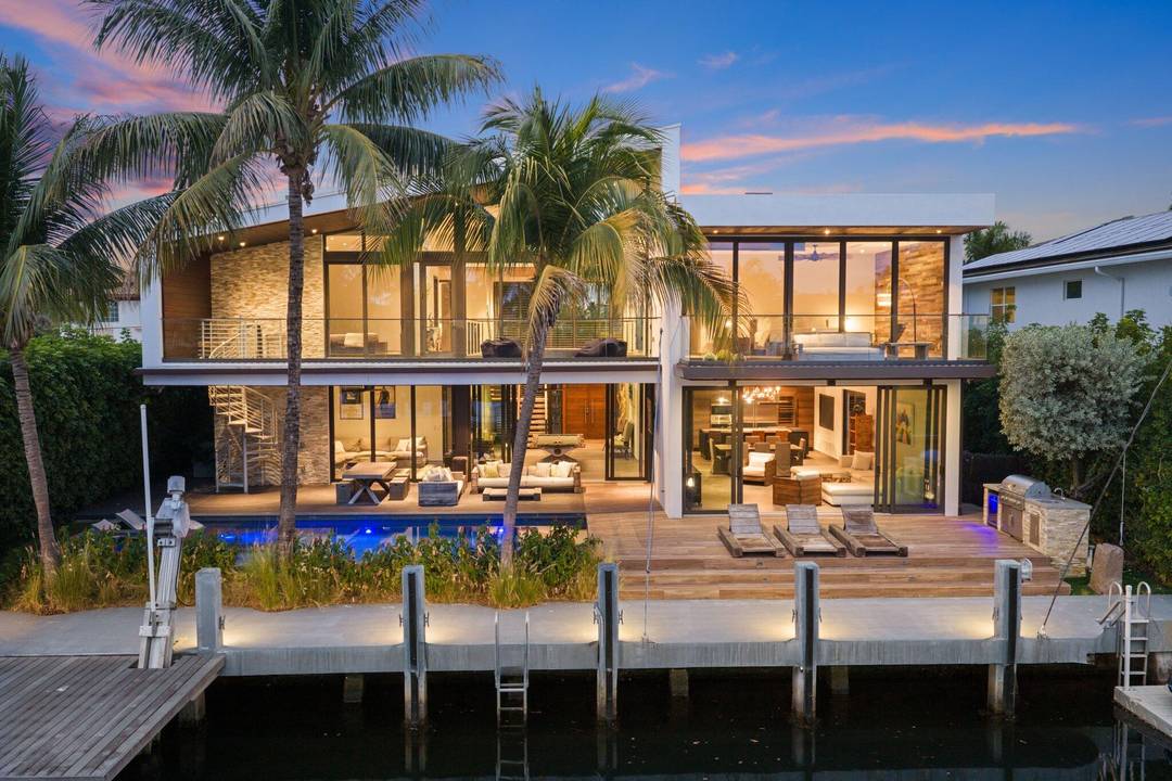 Stunning contemporary 5 bedroom office waterfront residence offering true boating freedom with no fixed bridges to the Intracoastal Waterway.