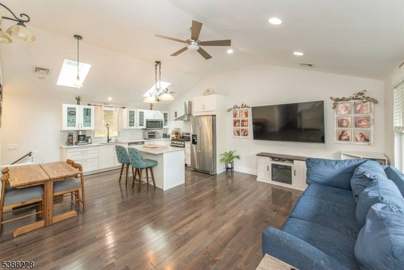 Welcome home to this completely updated, light filled 3 bedroom, 2 bath Ranch style home, where skylights and recessed lighting throughout brighten the rich hardwood floors and an open floor ...