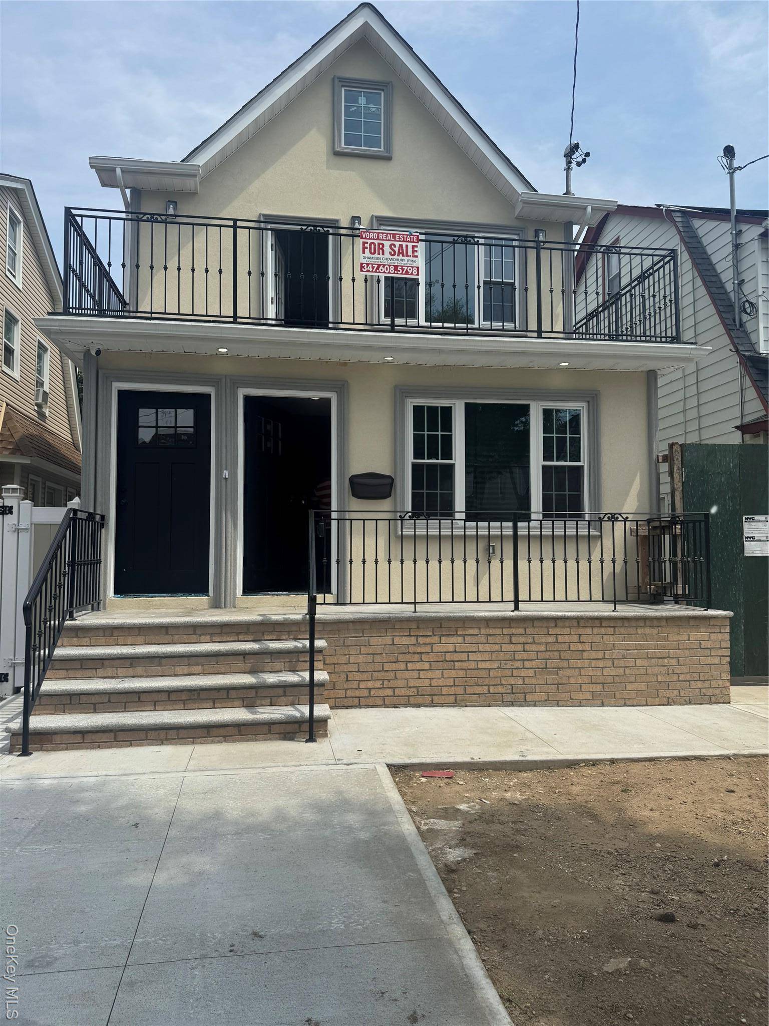 This beautiful new construction 2 family home offers five bedrooms and five full bathrooms with an inviting front balcony.