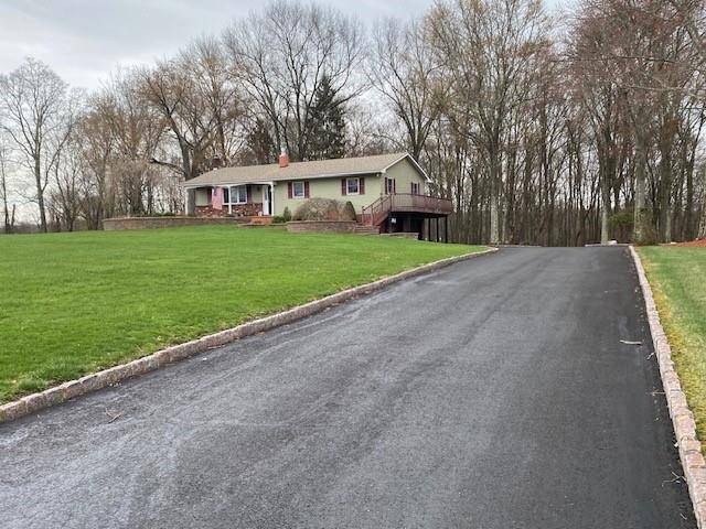 Nestled in a serene setting and on a double lot, this exceptional ranch style home offers the stunning kitchen, boasting sleek quartz countertops, ample cabinetry, and a cozy wood stove ...