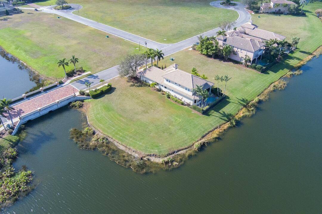 Located within the gated golf community of Tesoro, this building site offers 175 ft of spring fed lake waterfront, providing an ideal location for your future home.