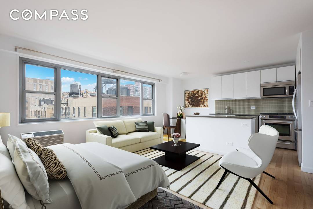 Welcome to this beautifully renovated studio with oversized windows, great natural light, and open western city views.