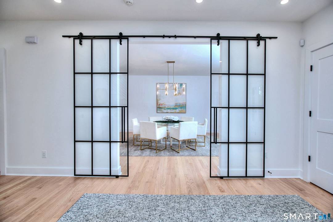 THIS NEW CONSTRUCTION CHECKS ALL THE BOXES OF A MODERN FARMHOUSE DESIGN.