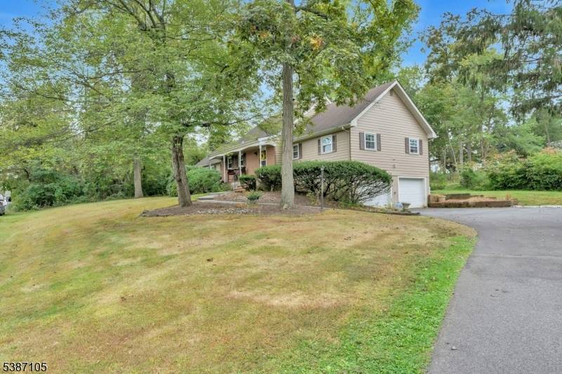 Large expanded ranch with large rooms, abundant closet space, open yard, front porch, 2 car garage, unfinished basement, patio fireplace in living room.