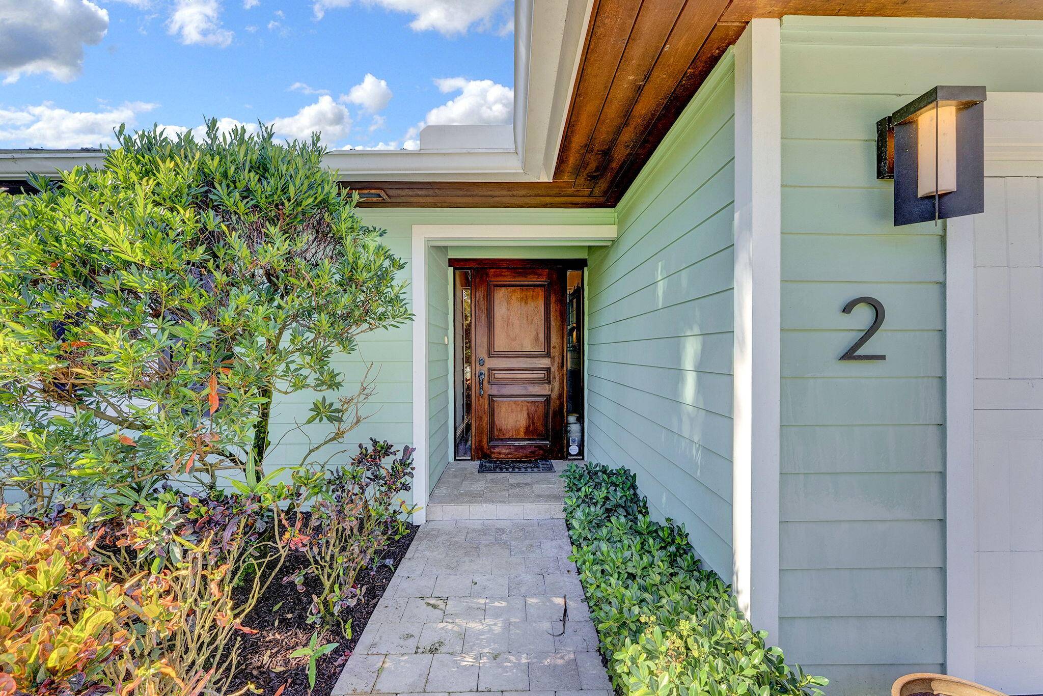 Escape the cold and embrace the sunshine in this beautifully appointed home, located in the highly desirable Lake Ida neighborhood in East Delray Beach.