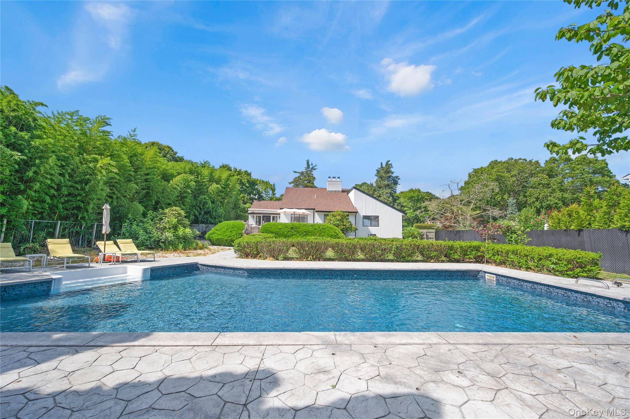 Nestled on a quiet street, this beautifully maintained 3 bedroom, 2 bath Hamptons home offers the perfect balance of luxury, comfort, and opportunity.