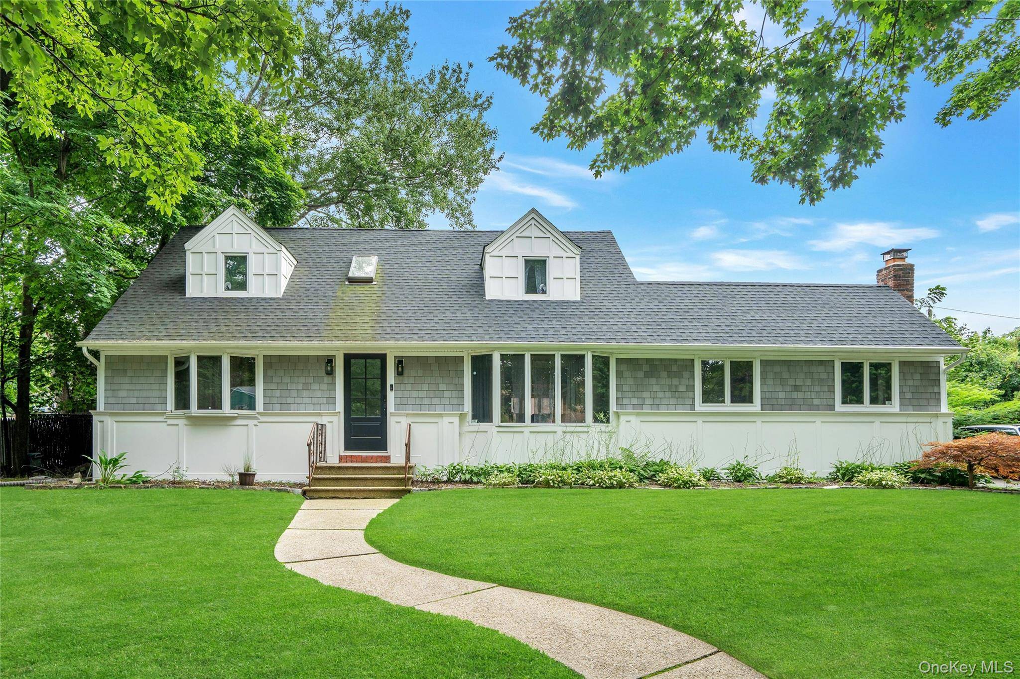 Welcome to 27 Middle Drive, a beautiful expanded cape on a quiet tree lined street within the highly sought after Harborfields School District !