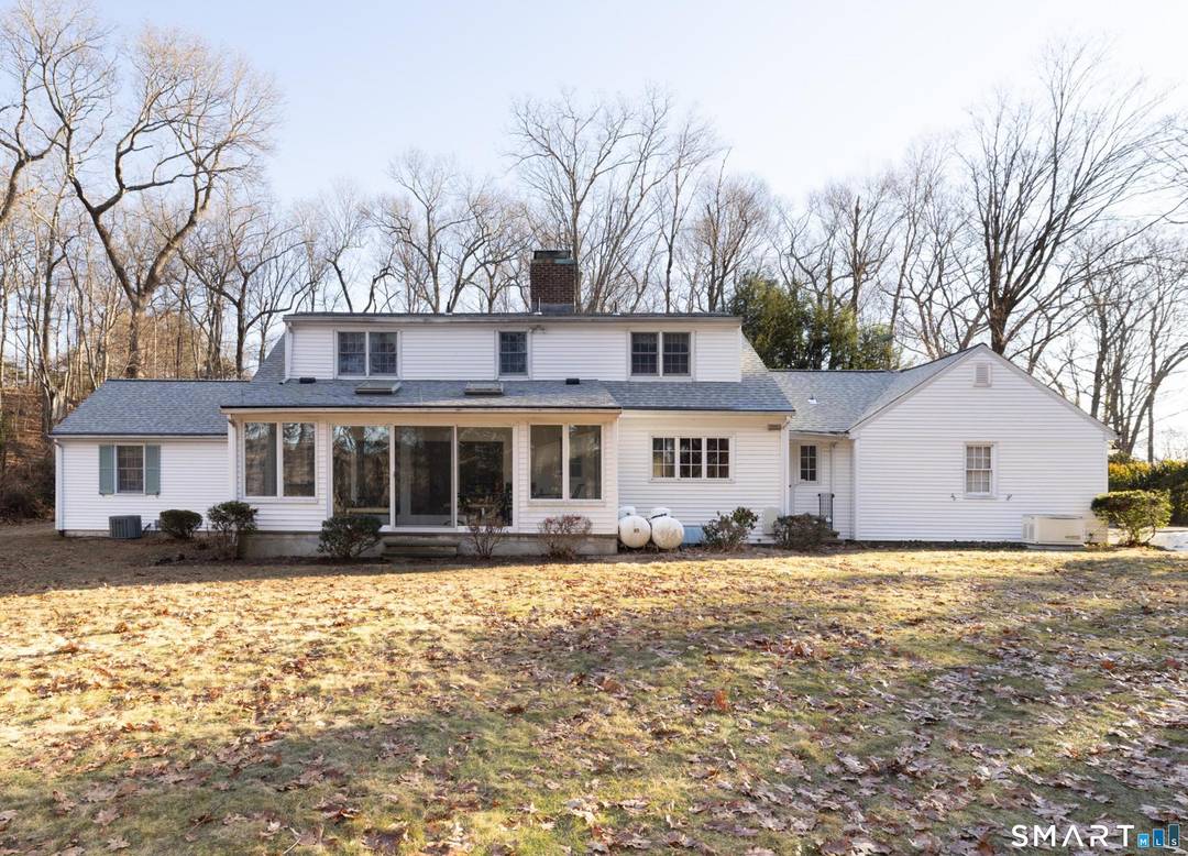 Elegant cape with refined main level living in Middlebury.