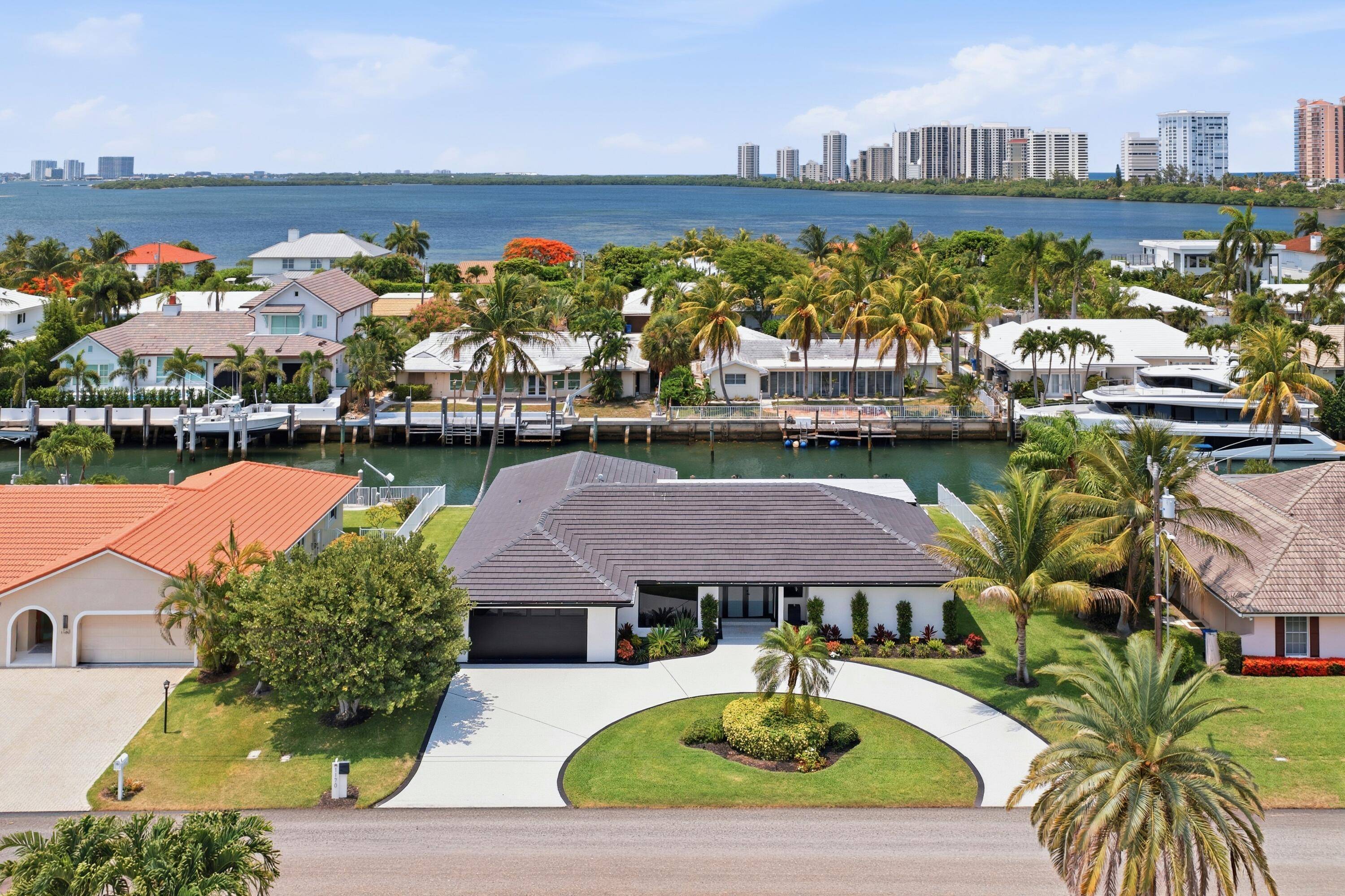 A boater's dream ! BEST PRICED Waterfront Single Family Home on Singer Island, 100' Dock for up to a 90' vessel.