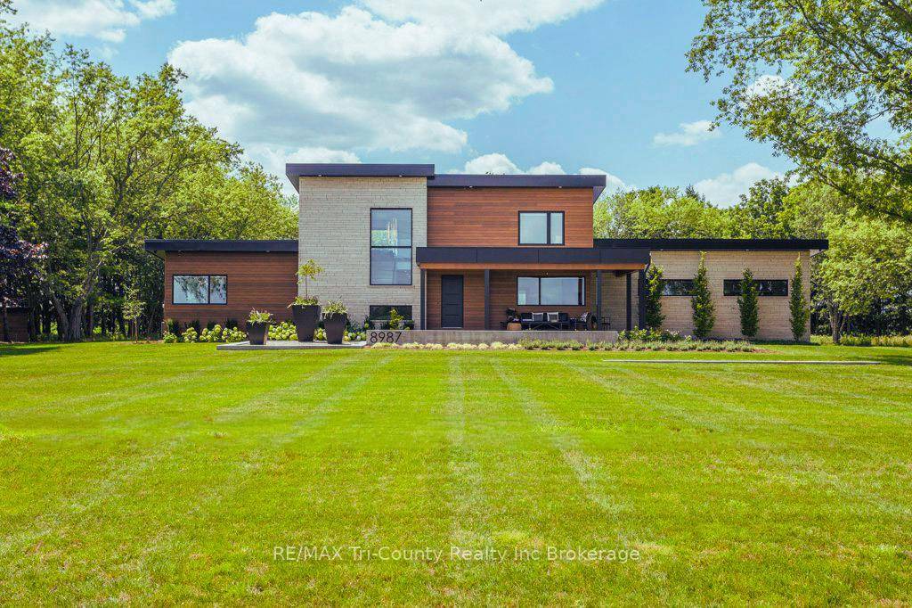 Set on a private 6 acre estate surrounded by mature pines, this custom built residence offers a rare blend of refined living, natural beauty, and exceptional versatility.