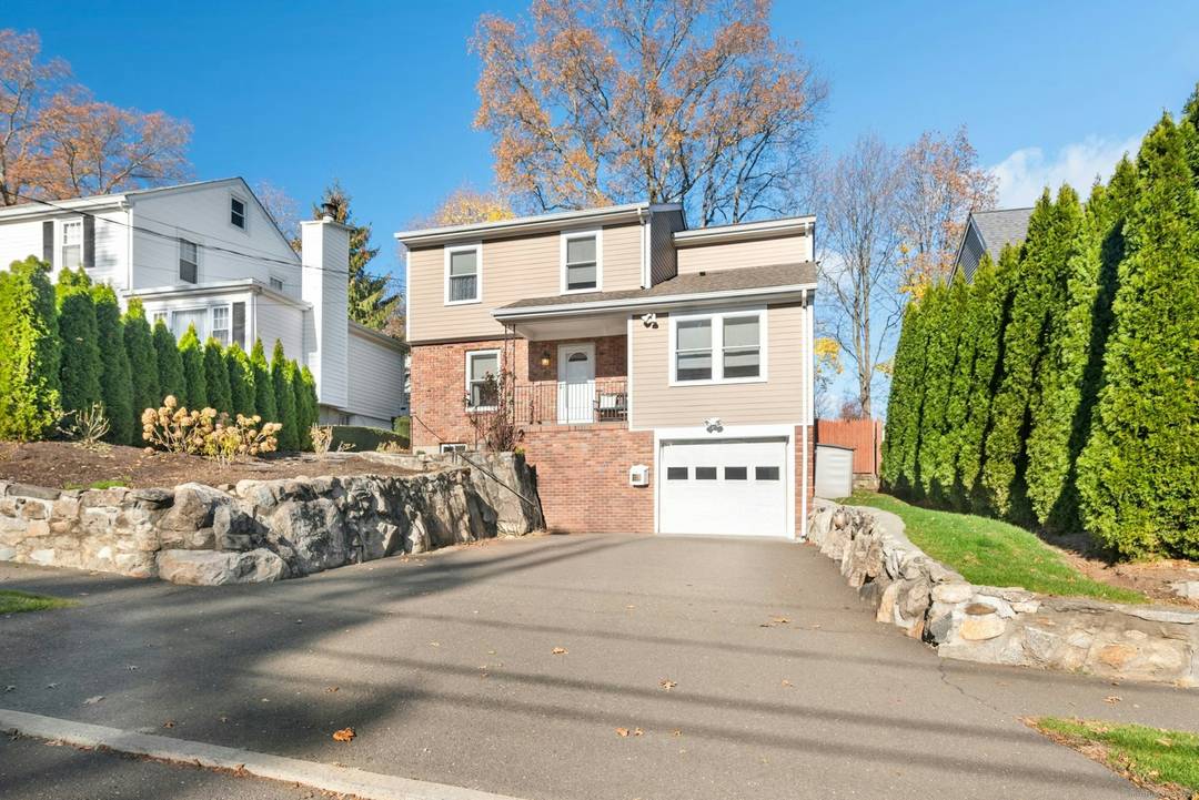 TOTALLY renovated Newfield colonial within walking distance to the Newfield Shopping Center, public transportation, schools and houses of worship.