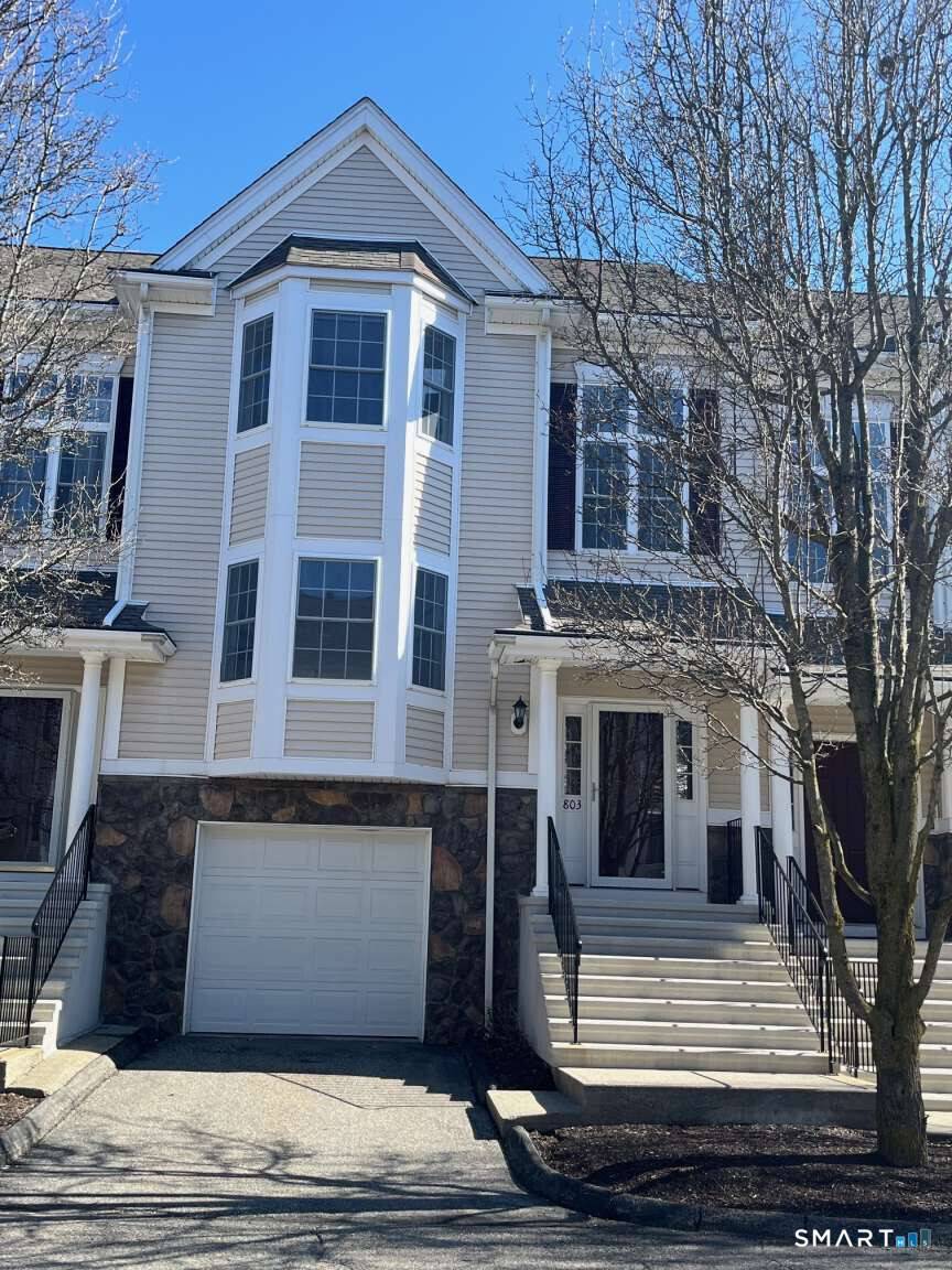 Welcome to 803 Larson Drive, a beautifully renovated tri level townhouse nestled in the highly desirable and beautifully maintained Kensington Woods community in Danbury.