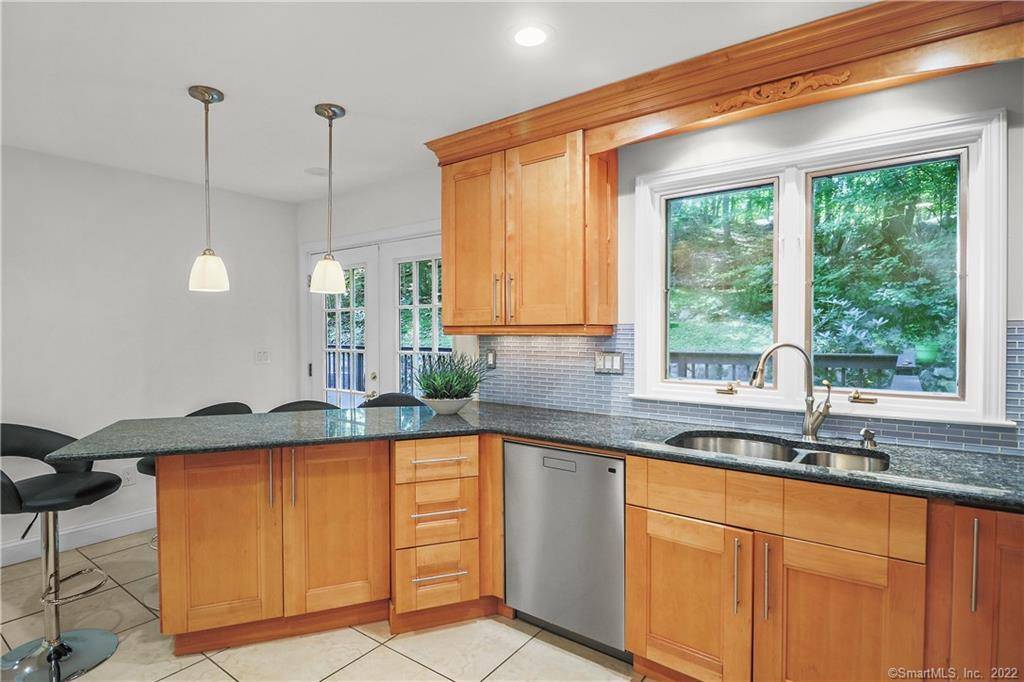 Pristine Mediterranean Colonial nestled in quiet North Stamford with 4 bedrooms and 2.