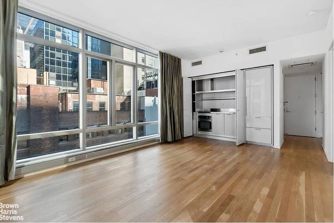 Experience luxurious living in this bright corner one bedroom residence at The Centria, a full service condominium located at 18 West 48th Street.