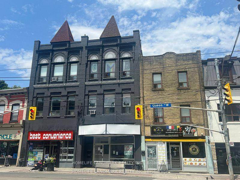 Three story commercial residential brick building ; architectural details, facade and roof recently updated.