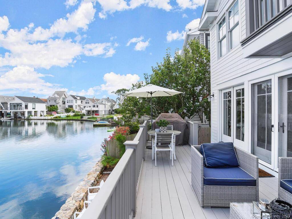 Stunning direct waterfront Nantucket style home overlooking Sherwood Mill Pond at Westport's Compo Beach.
