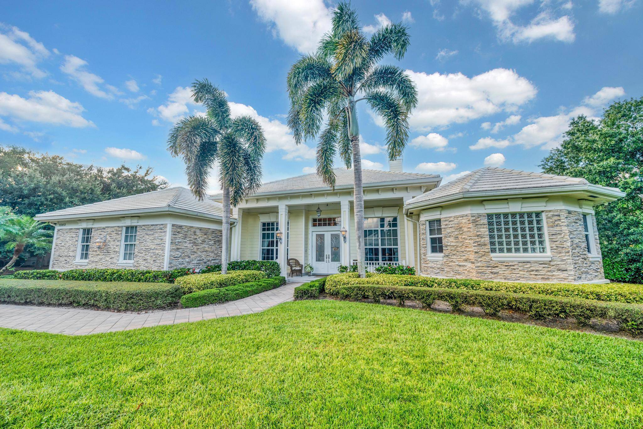 Welcome to 1563 SW Jasmine Trace, a beautifully designed 5 bedroom, 3 bathroom waterfront home in the prestigious Orchid Bay community of Palm City, FL.