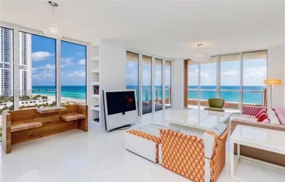 Experience the ultimate oceanfront lifestyle from this impeccably renovated NE corner residence in Acqualina s highly sought after 01 line.