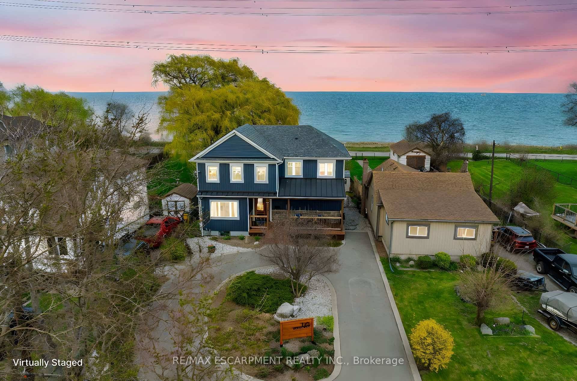 Welcome to 175 Beach Boulevard a captivating blend of sophistication and serenity, newly renovated in 2024 and set directly on the renowned Waterfront Trail with unobstructed views of Lake Ontario.
