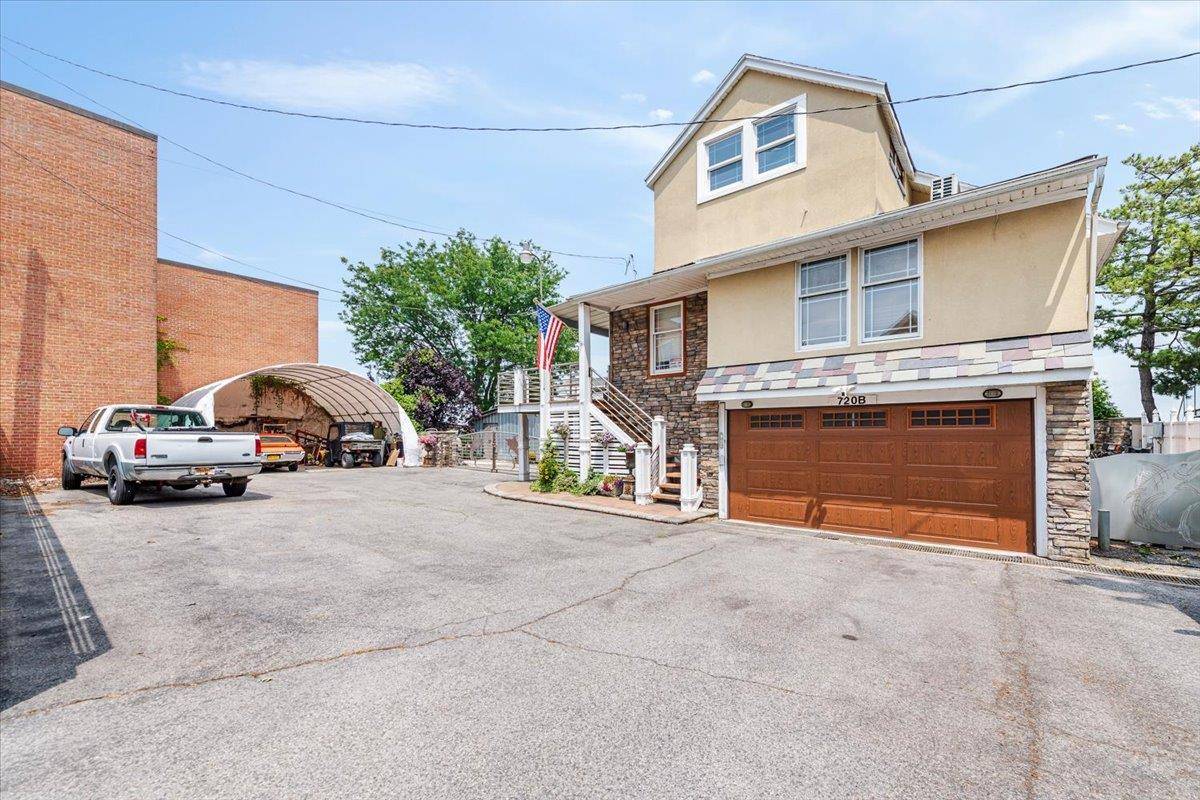 Experience waterfront living at its finest in this stunning legal two family home, situated on an expansive 18, 525 sq ft lot in Throggs Neck.