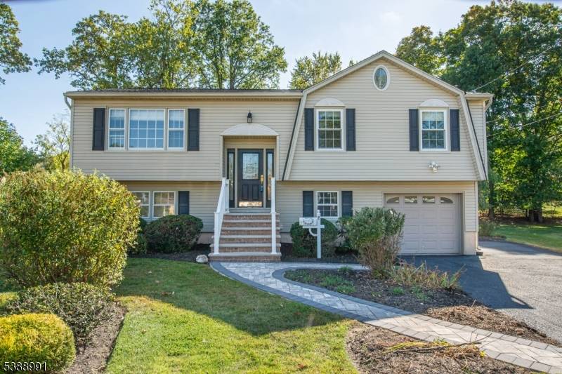 Enjoy the best of convenience and comfort with this picturesque bilevel, ideally situated in the center of town just a short walk to schools, shops, and local parks.