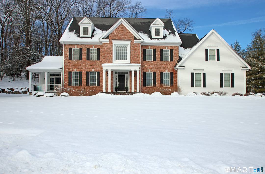 An impeccable ten room Colonial filled with architectural detail and timeless charm.
