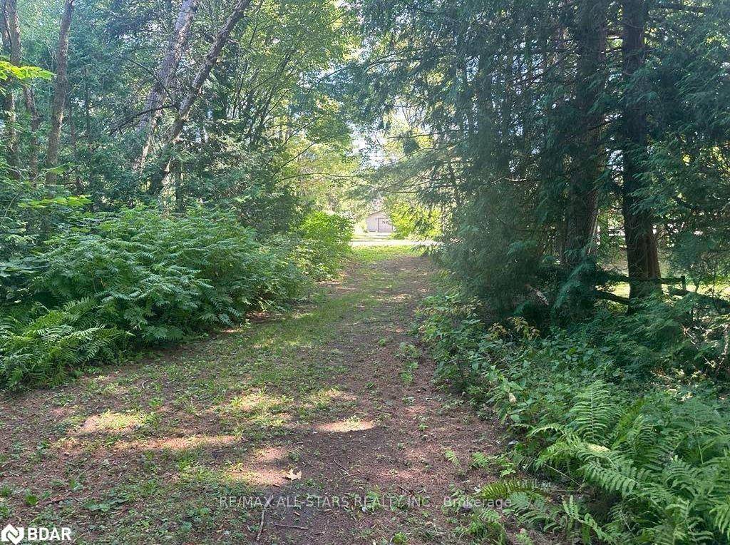 Perfectly situated half acre building lot just off of River Road with municipal water access point to the Burnt River.