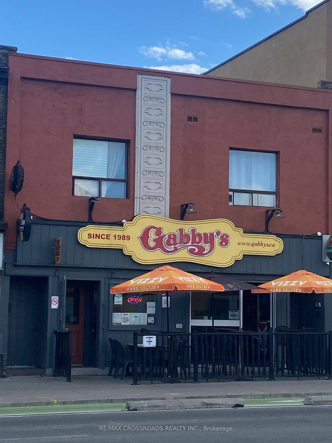 Two store frontages turned into one, with two one bedroom apts.