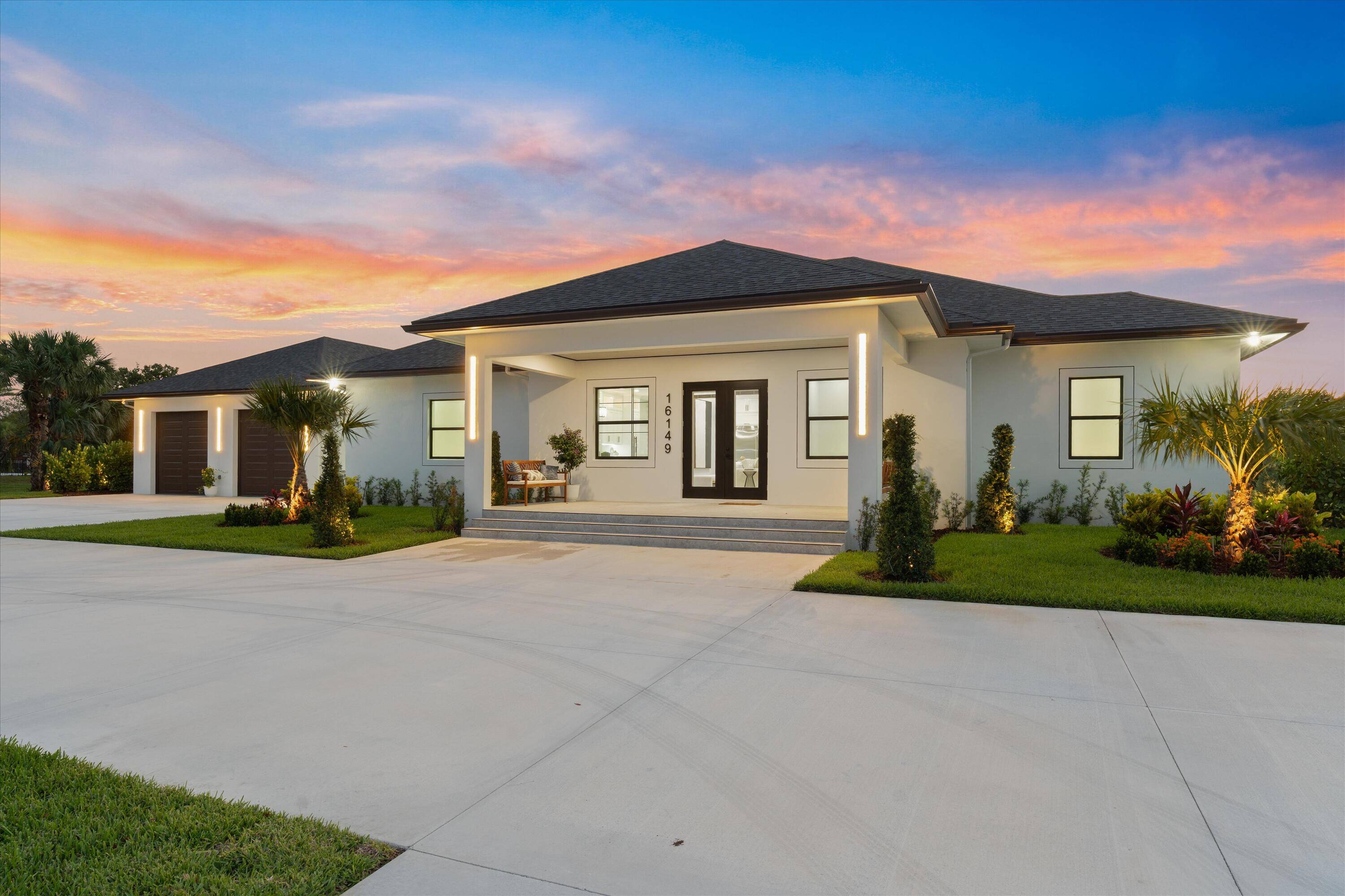 Contemporary Country Living with Detached 6 Car Garage WorkshopExperience modern luxury and peaceful rural living in this newly built custom home, located in the desirable Palm Beach Country Estates.