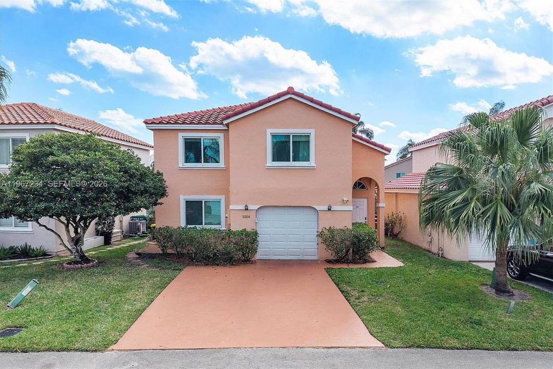 Stunning fully renovated waterfront two story home in the highly desirable gated community of Sheridan Ocean Club.