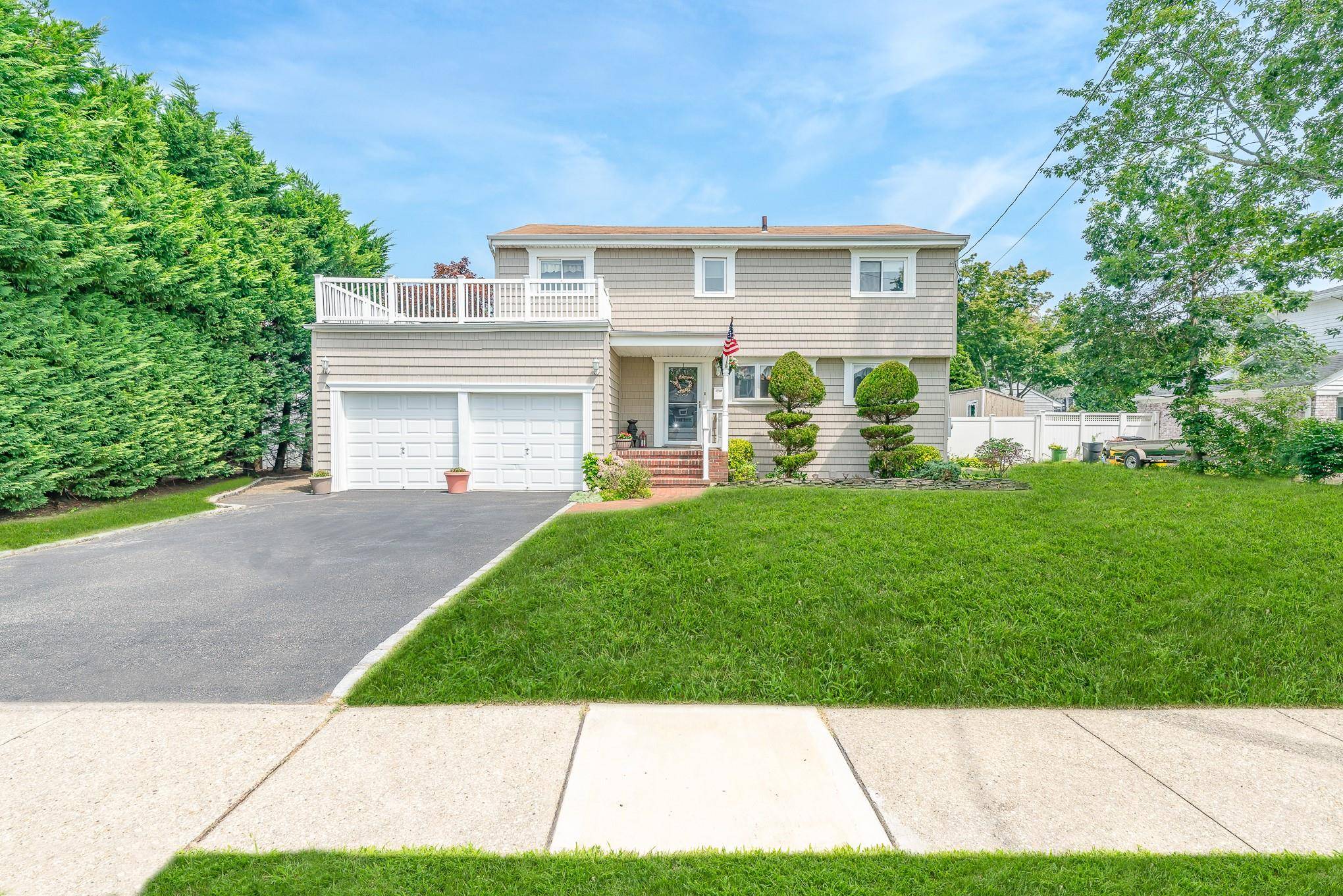 Welcome to this charming 4 bedroom split level home in Nassau Shores on a large lot !