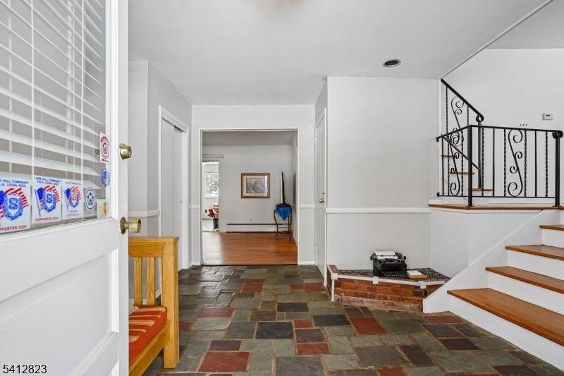 Nestled on a beautifully level lot, this spacious split level home offers exceptional comfort, functionality and timeless charm.