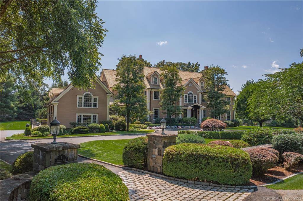 Refined living awaits on Boxwood Lane, a prime Hunt Club cul de sac featuring tranquil private entrances to stately colonial style homes.