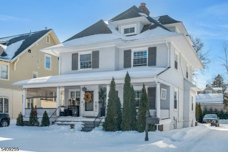 Beautifully renovated Montclair Colonial in the heart of the Historic District, featuring a custom gourmet kitchen open to the living room, a gorgeous dining room, and a powder room.