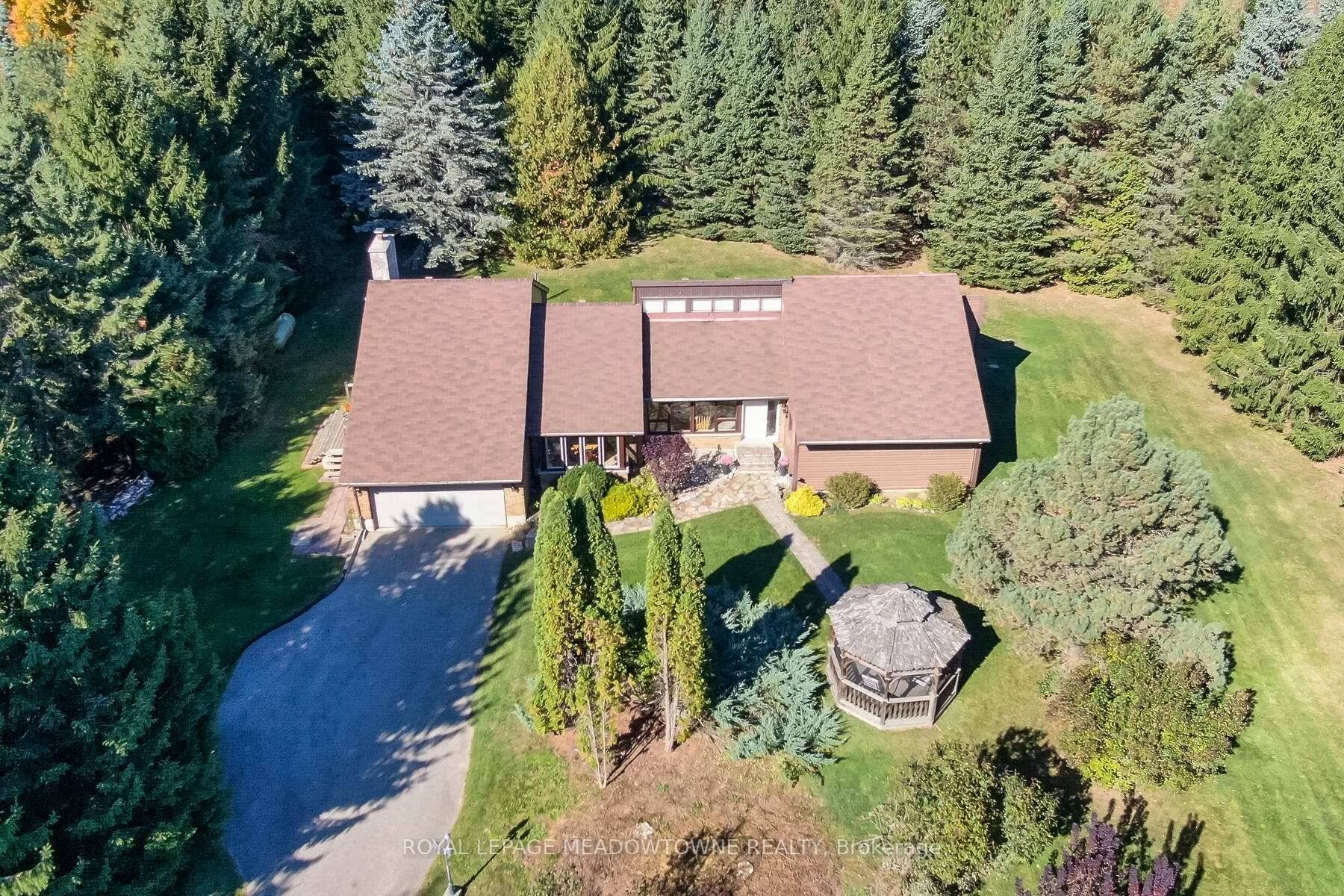 Fabulous bungalow on private 2 acre lot in prime location in Halton Hills.
