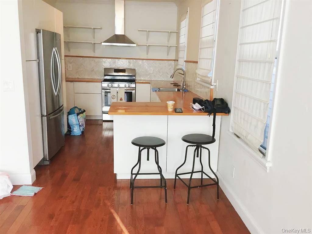 2 Family frame semidetached well maintained house in the heart of Woodside on a 27X115 lot, Zoning R5D, There are 4000 sq ft extra buildable air rights available.