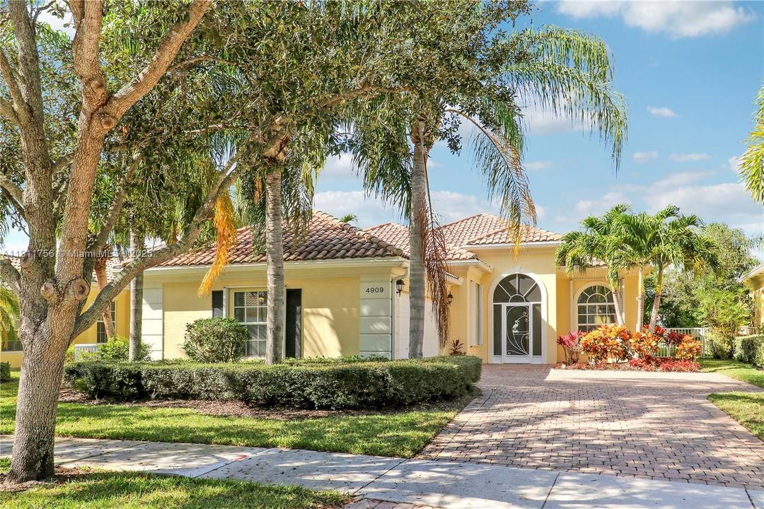 Welcome to this beautiful updated DiVosta built home in the gated community of Magnolia Bay in Palm Beach Gardens.