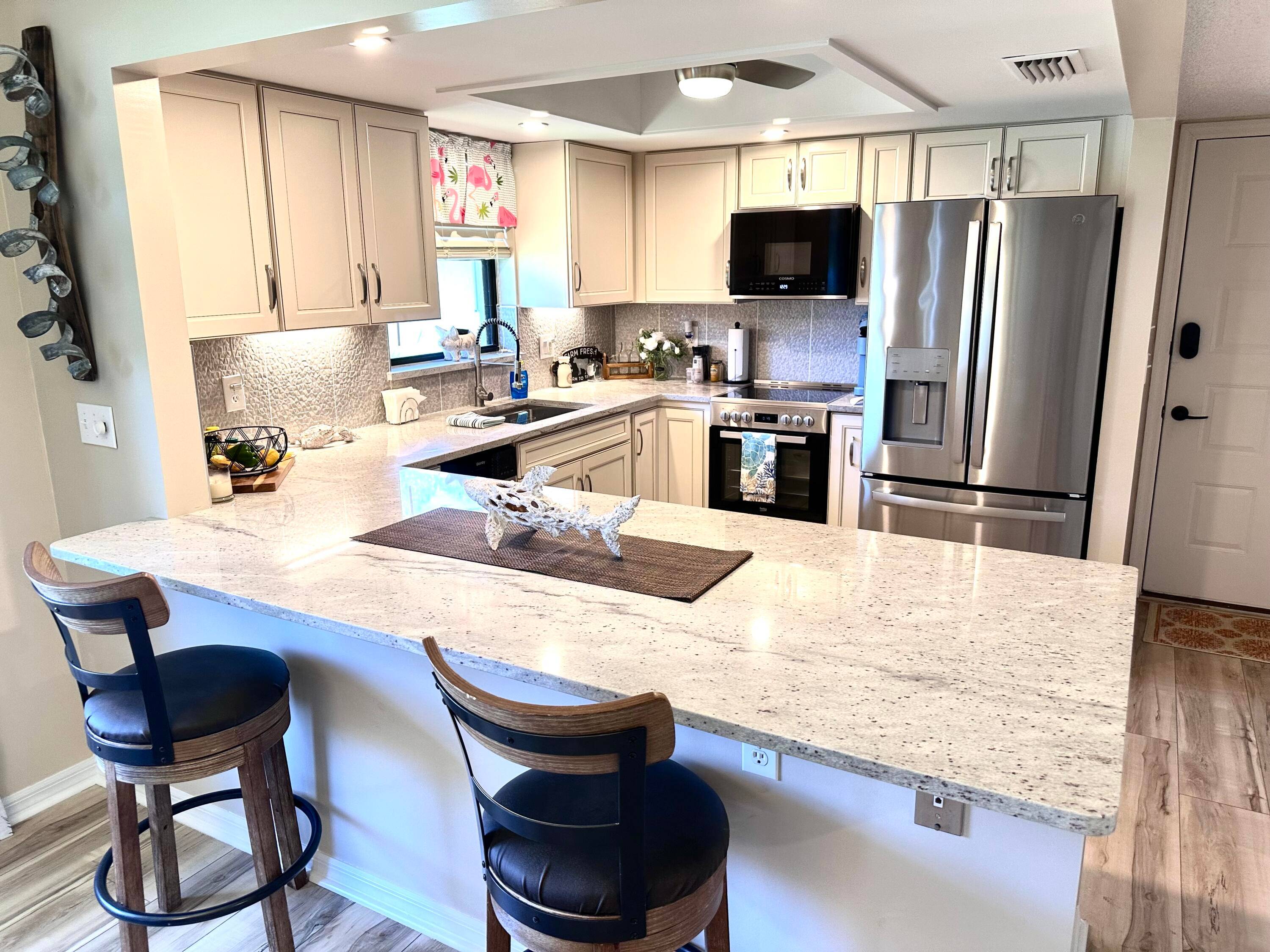 MOTIVATED SELLERS ! Tastefully remodeled 2 2 corner unit on 2nd floor in one of Martin County's most desirable active 55 communities.