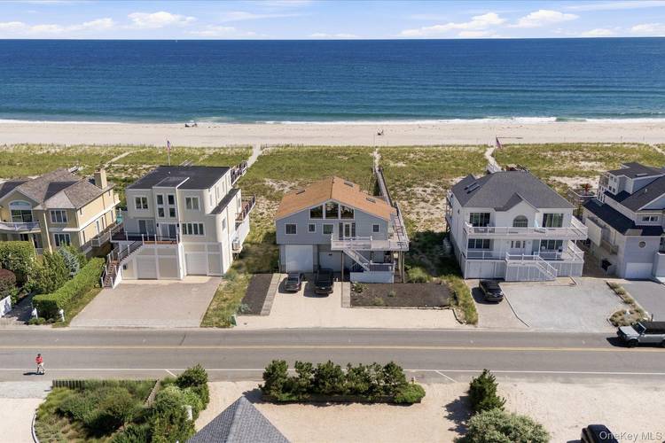 Savor the magic of September on the oceanfront in this three bedroom retreat, where the Atlantic serves as your private backyard across an expansive 75 foot wide property.