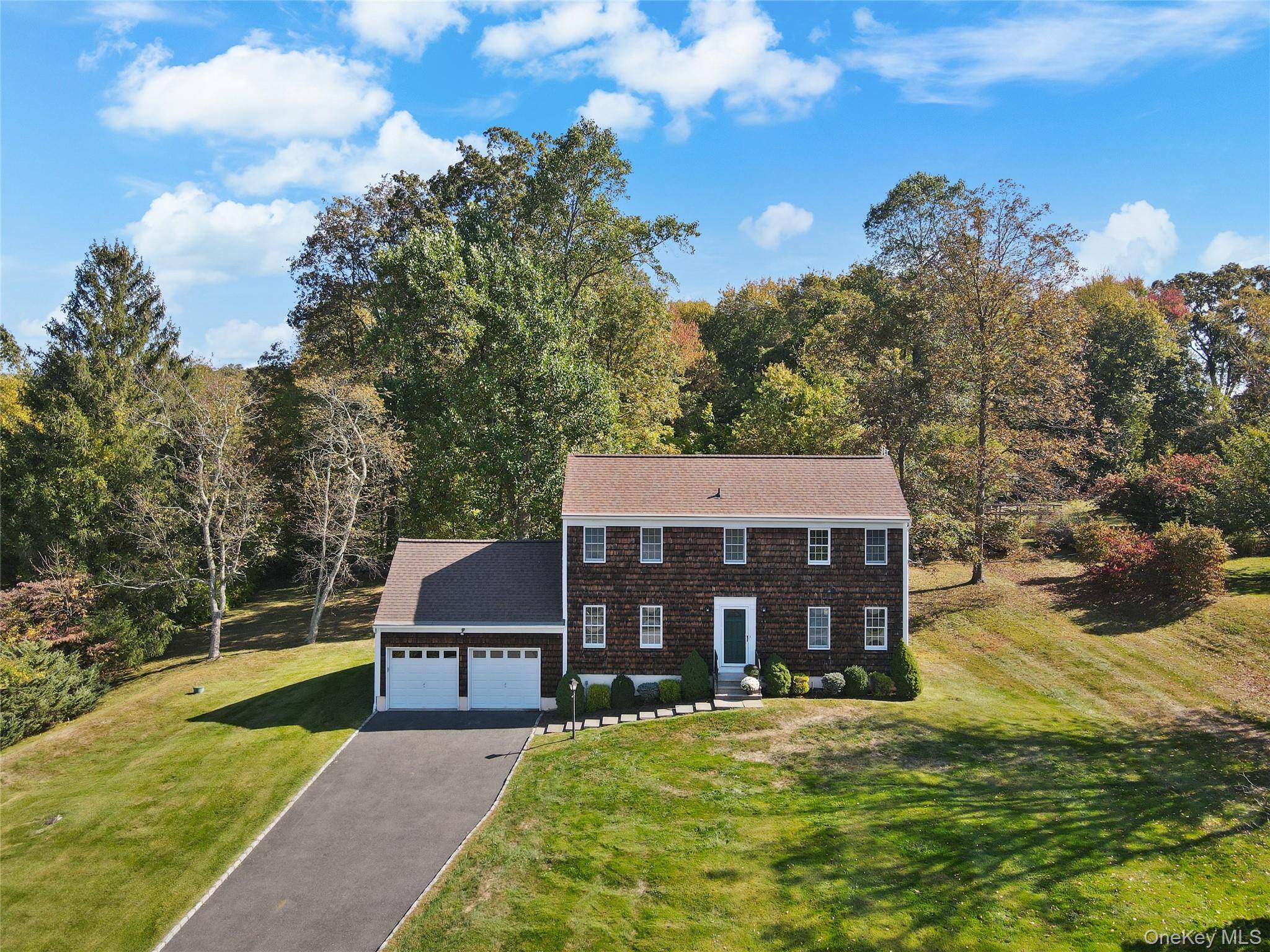 Set on a beautiful, gently rolling acre with distant views, this inviting three bedroom Colonial offers a perfect blend of comfort and convenience.