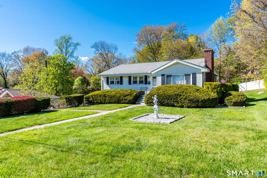 Discover the perfect blend of comfort and potential in this classic 1961 ranch, perfectly situated on a half acre lot.