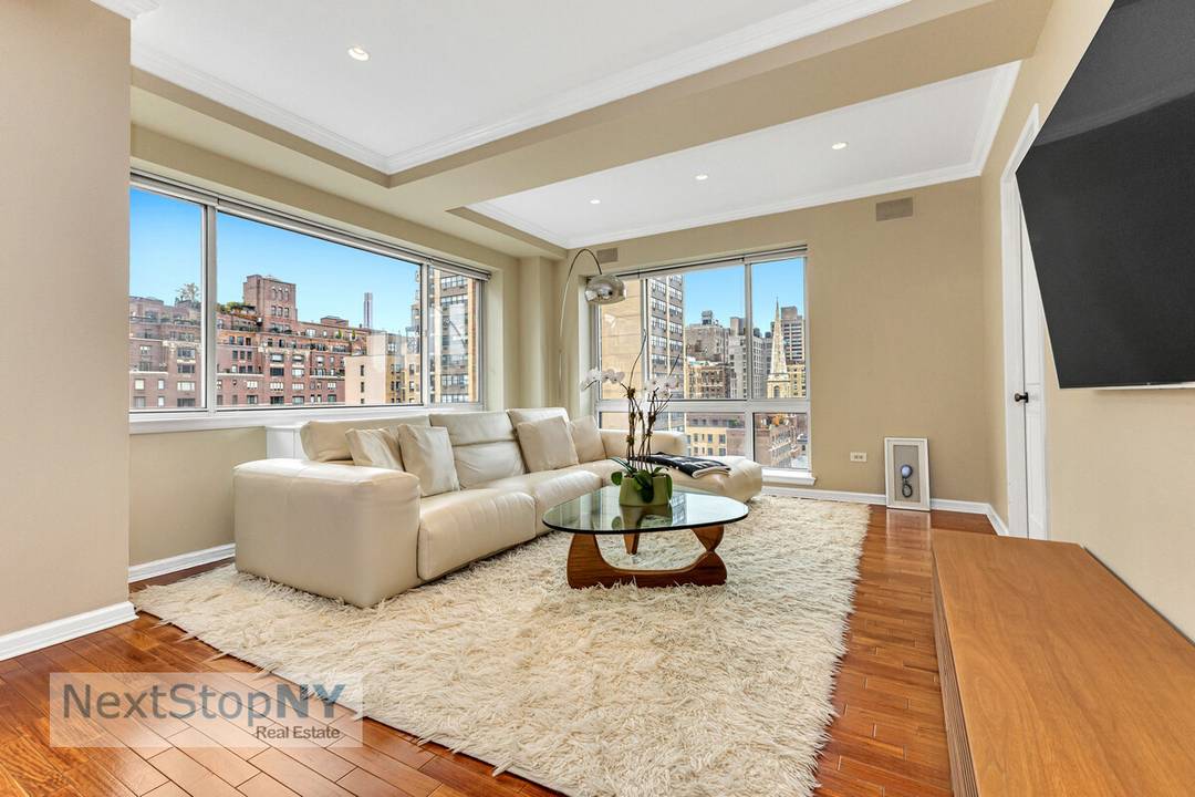 Elegant Upper East Side Corner Residence Sunny and spacious, this beautifully designed 3 bedroom, 3 bath corner home offers open south and west exposures and a rare 1, 949 sq.