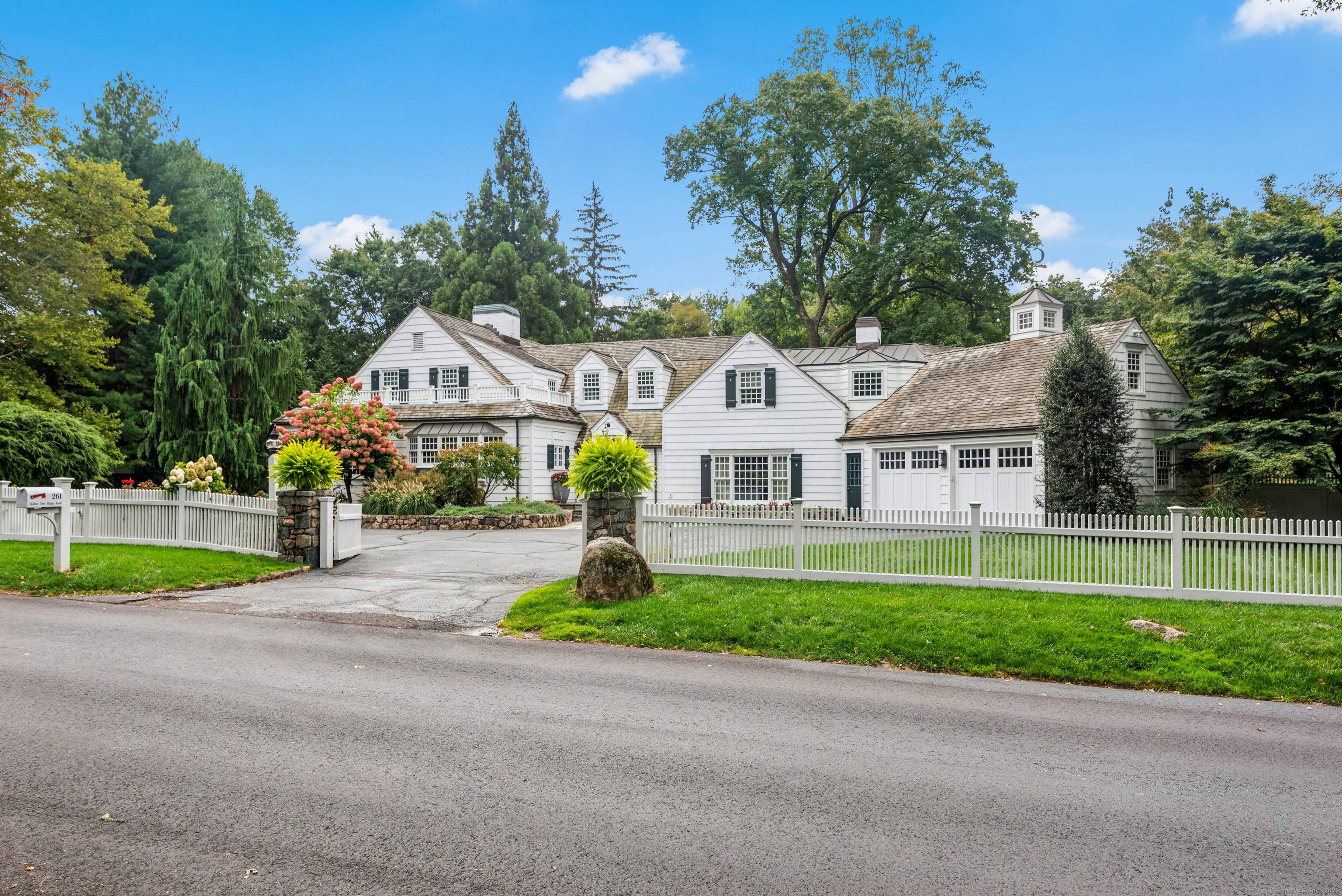 This charming 5 bedroom Cape Cod home is the perfect blend of classic elegance and modern comfort.
