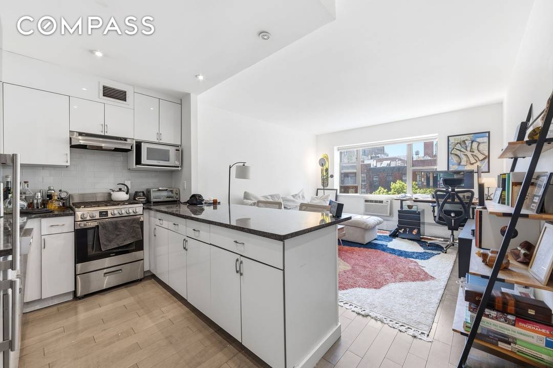 Renovated to perfection, this large 1 Bedroom home has bright and sunny west facing windows plus an oversized Island kitchen.