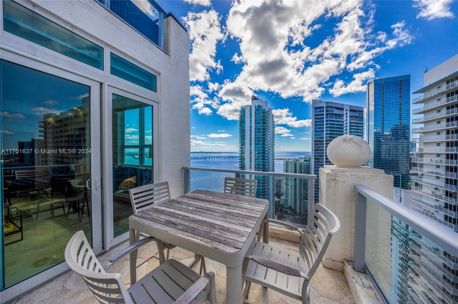Immaculate corner penthouse with 2 master suites and 2.