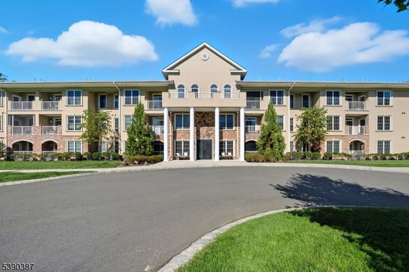 Experience easy living in this beautifully maintained second floor residence within the gated Fox Hill community.