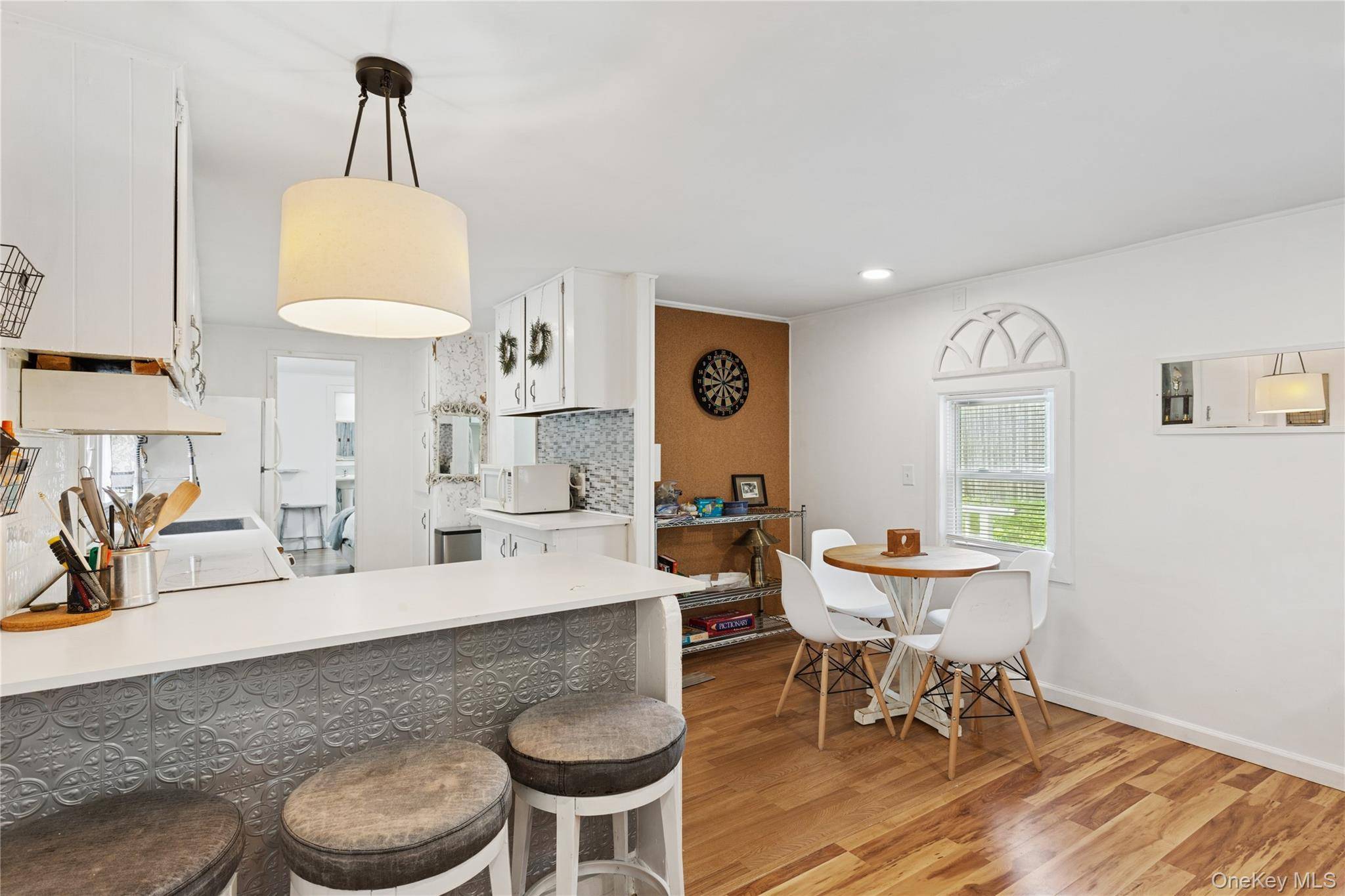 Welcome to 8 Railroad Avenue, a haven of comfort and convenience nestled in the heart of Jamesport.